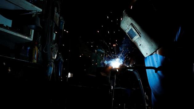 Almir Melishte, 46, works on a bell clapper at the Galanopoulos bell foundry. For the brothers, the foundry is a labour of love. “You have to be nuts about this job to do it. It’s not for everyone,” said Thomas, who took over aged just 12 when their father suddenly died. (Alkis Konstantinidis / REUTERS)