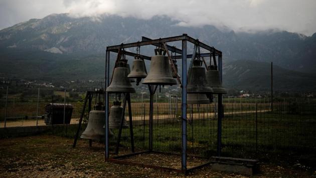 Discarded bells engraved with the family name, some dating back to the 19th century, are stacked in the yard. Christos’ first bell from 40 years ago still hangs in a church in town. (Alkis Konstantinidis / REUTERS)