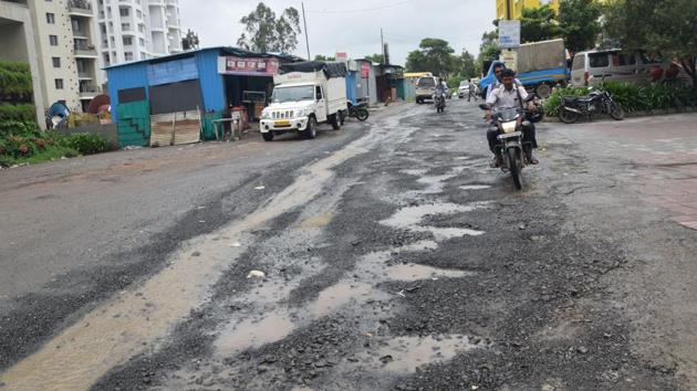 Bad condition of the road in Mhalunge in Pune.(HT PHOTO)