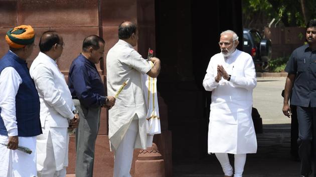Prime Minister Narendra Modi (right) is greeted by Parliamentary affairs minister Ananth Kumar, Union MoS for Parliamentary Affairs Vijay Goel, MoS Arjun Ram Meghwal as he arrives to address the media ahead of the Monsoon session of Parliament in New Delhi, on July 18, 2018.(Arvind Yadav/HT Photo)