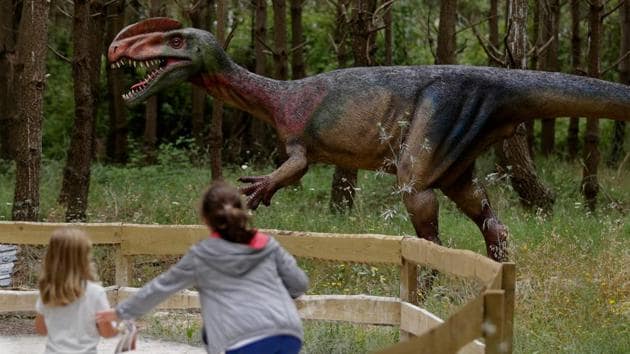 Children visit the Dino Park, an outdoor museum with more than 120 models of dinosaurs, in Lourinha.(AFP)