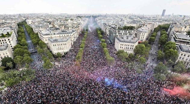 A picture taken from the top of the Arch of Triumph (Arc de Triomphe) shows people celebrating France’s victory in the Russia 2018 World Cup final football match between France and Croatia, on the Champs-Elysees avenue in Paris. (Ludovic Marin / AFP) A picture taken from the top of the Arch of Triumph (Arc de Triomphe) shows people celebrating France’s victory in the Russia 2018 World Cup final football match between France and Croatia, on the Champs-Elysees avenue in Paris. (Ludovic Marin / AFP)