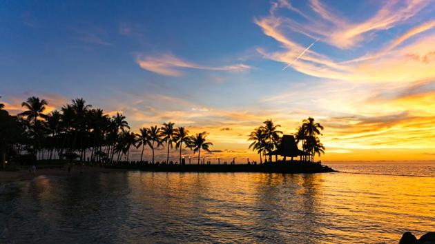A scenic beach view during a sunset in Malaysia’s Sabah Borneo. (Shutterstock) 