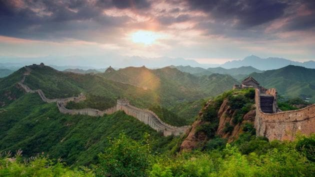 Sunset through ominous storm clouds at the Great Wall of China.  (shutterstock) 