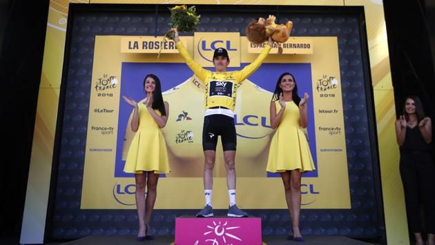 Stage winner Britain’s Geraint Thomas and new overall leader celebrates on the podium after the eleventh stage over 108.5 kilometers with start in Albertville and finish in La Rosiere Espace San Bernardo, France. (Christophe Ena / AP) Stage winner Britain’s Geraint Thomas and new overall leader celebrates on the podium after the eleventh stage over 108.5 kilometers with start in Albertville and finish in La Rosiere Espace San Bernardo, France. (Christophe Ena / AP)