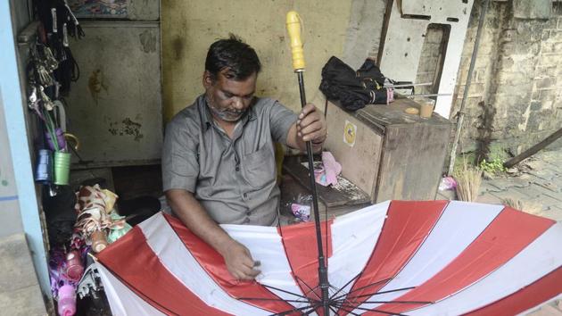 With the rains taking a break, umbrella repairs were on in full swing at Sadashiv peth. (HT photo) With the rains taking a break, umbrella repairs were on in full swing at Sadashiv peth. (HT photo)