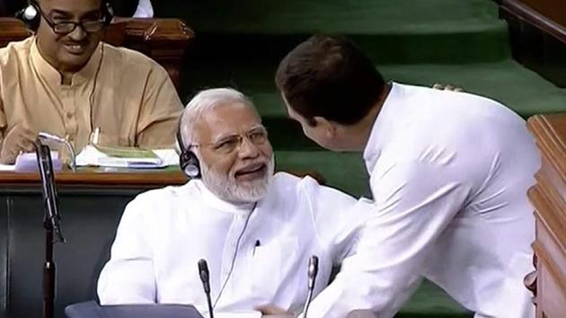 Congress President Rahul Gandhi interacts with Prime Minister Narendra Modi after his speech in the Lok Sabha on 'no-confidence motion' during the Monsoon Session of Parliament, in New Delhi on Friday.(PTI Photo)