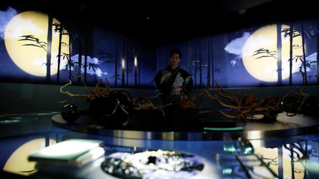 A staff introduces a course from the menu while projection mapping is cast on a table and walls. The restaurant is the brainchild of Ryotaro Muramatsu, director of the design firm Naked Inc., known for its digital mapping projects across Japan. (Kim Kyung-Hoon / REUTERS) A staff introduces a course from the menu while projection mapping is cast on a table and walls. The restaurant is the brainchild of Ryotaro Muramatsu, director of the design firm Naked Inc., known for its digital mapping projects across Japan. (Kim Kyung-Hoon / REUTERS)
