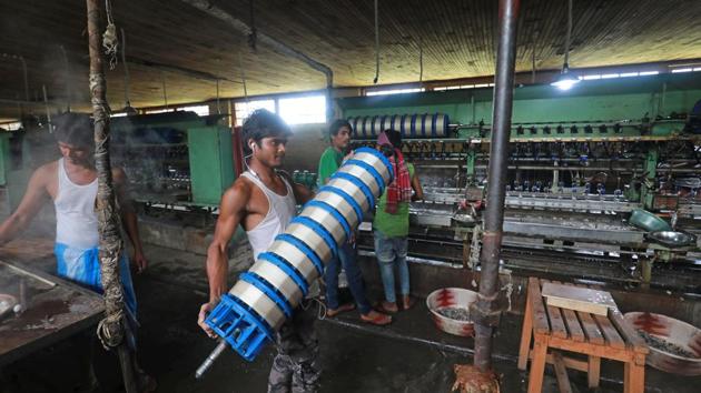 A worker moves spools of harvested silk at the Solina factory. The industries department has been planning to bring three more machines with 30 basins to increase production. “So far we have not made much investment and are treading cautiously but in the second phase we want to buy some machines and in the third phase we will focus on its infrastructure. We are taking a holistic view,” said Iqbal. (Waseem Andrabi / HT Photo) A worker moves spools of harvested silk at the Solina factory. The industries department has been planning to bring three more machines with 30 basins to increase production. “So far we have not made much investment and are treading cautiously but in the second phase we want to buy some machines and in the third phase we will focus on its infrastructure. We are taking a holistic view,” said Iqbal. (Waseem Andrabi / HT Photo)