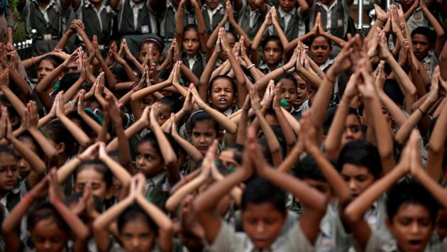 School students pray for rain at a temple in Ahmedabad, Gujarat on July 19, 2018. (Amit Dave / REUTERS)