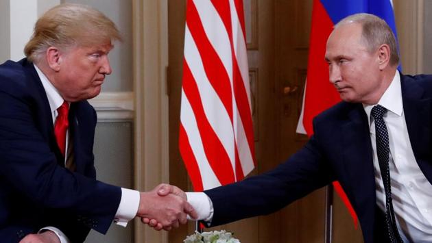 US President Donald Trump and Russian President Vladimir Putin shake hands as they meet in Helsinki, Finland. (Kevin Lamarque / REUTERS) US President Donald Trump and Russian President Vladimir Putin shake hands as they meet in Helsinki, Finland. (Kevin Lamarque / REUTERS)