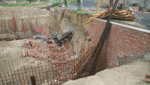 A four-year-old boy and a daily wage worker were killed in the collapse,(HT Photo)