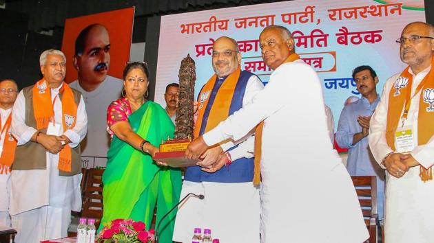 Bhartiya Janta Party president Amit Shah with Rajasthan chief minister Vasundhara Raje during the closing ceremony of state working committee meeting, in Jaipur on July 21.(PTI Photo)