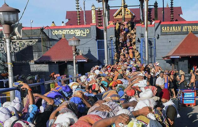 In this file photo dated November 18, 2013, devotees wait at Lord Ayyappa temple, Sabarimala. The Supreme Court has said women have the constitutional right to enter Sabarimala temple in Kerala and pray like men without being discriminated against(PTI)