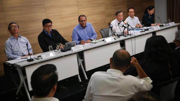 Cyber Security Agency CEO David Koh, MCI Permanent Secretary Gabriel Lim, Minister for Communications and Information S. Iswaran, Health Minister Gan Kim Yong, Ministry of Health Permanent Secretary Chan Heng Kee and SingHealth CEO Ivy Ng attend a press conference regarding the SingHealth cyber attack in Singapore.(AFP Photo)