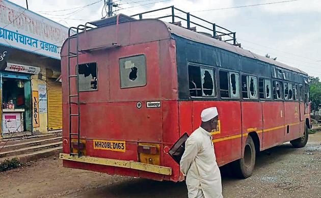 The protest called by the Maratha Kranti Morcha demanding reservation turned violent on Saturday as protestors burnt a state transport bus at Sangola in Solapur district.(HT Photo)