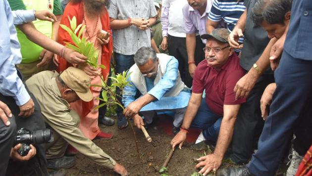 Chief minister Trivendra Singh Rawat plants a sapling at Kervan village near Dehradun on Sunday. (HT Photo) Chief minister Trivendra Singh Rawat plants a sapling at Kervan village near Dehradun on Sunday. (HT Photo)
