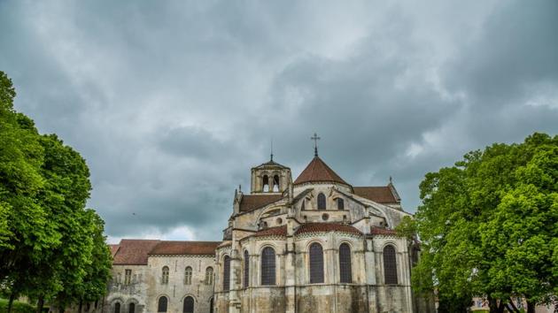 Vézelay in France is a hilltop town and UNESCO world heritage site located in Burgundy. It is famous for Vézelay Abbey, a church that dates back to the 11th century. In summer, you can spot beautiful geraniums along the streets, picturesque sunsets, and stunning architecture. (shutterstock)