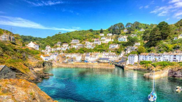 Polperro in England is a traditional Cornish fishing village. You can unwind, breathe in fresh air and take in views of the clear blue sea. (shutterstock)