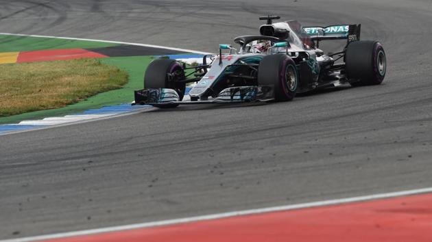 Mercedes' British driver Lewis Hamilton steers his car during the German Formula One Grand Prix at the Hockenheim racing circuit.(AFP)