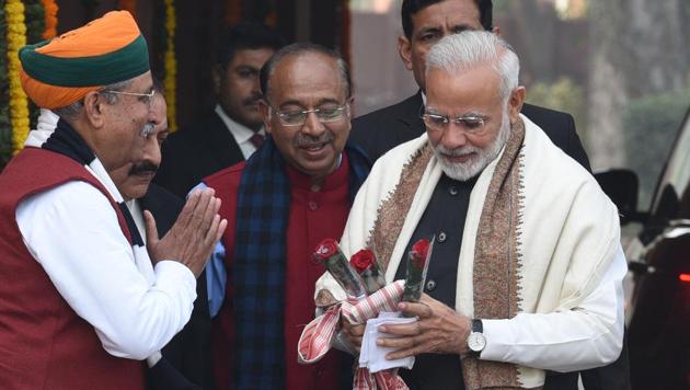 Prime Minister Narendra Modi (right) is welcomed by minister of state Arjun Ram Meghwal (left) for the first day of budget session of Parliament, in New Delhi, in January 2018.(Arvind Yadav/HT File Photo)