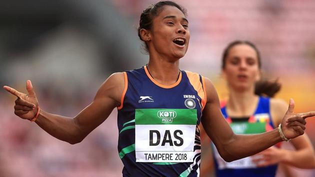 Hima Das celebrates after winning gold in the final of the women's 400m on day three of the IAAF World U20 Championships.(PTI)