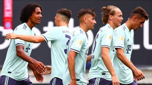 Bayern Munich's Joshua Zirkzee celebrates with team mates after scoring their third goal against Paris Saint-Germain.(REUTERS)