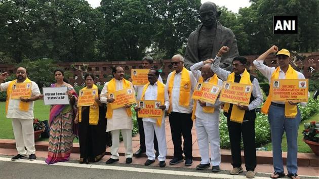 TDP MPs protest in front of Mahatma Gandhi statue in Parliament. (ANI Photo) TDP MPs protest in front of Mahatma Gandhi statue in Parliament. (ANI Photo)
