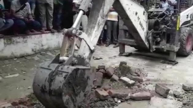 Officials dig in a shelter home premise after statement of one of the victims that a girl was beaten to death and buried in the premises following a disagreement with staff members. At least 11 people, including some government officials, have been arrested in connection with the alleged sexual abuse of the girls at the non-government organisation Seva Sankalp Evam Vikas Samiti on Sahu Road in Muzaffarpur. (ANI)