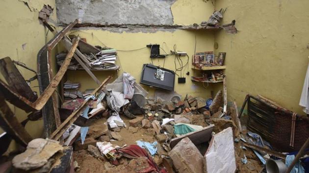 The roof of a house in Delhi’s Dwarka area that had weakened over time with seepage collapsed in the early hours of the morning, killing a couple and injuring their three children, police said. (Vipin Kumar / HT Photo)