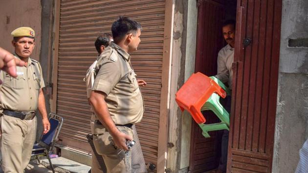 Delhi Police takes away the stools, which were supposed to be used by the Bhatia family members while committing suicide, at Burari in New Delhi on Friday, July 6, 2018.(PTI File)