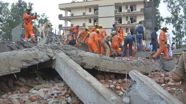 National Disaster Response Force seen carrying out rescue operation after an under-construction building collapsed in Ghaziabad, killing at least one person at Akash Nagar on Sunday, July 22, 2018. (Sakib Ali/ HT Photo) National Disaster Response Force seen carrying out rescue operation after an under-construction building collapsed in Ghaziabad, killing at least one person at Akash Nagar on Sunday, July 22, 2018. (Sakib Ali/ HT Photo)