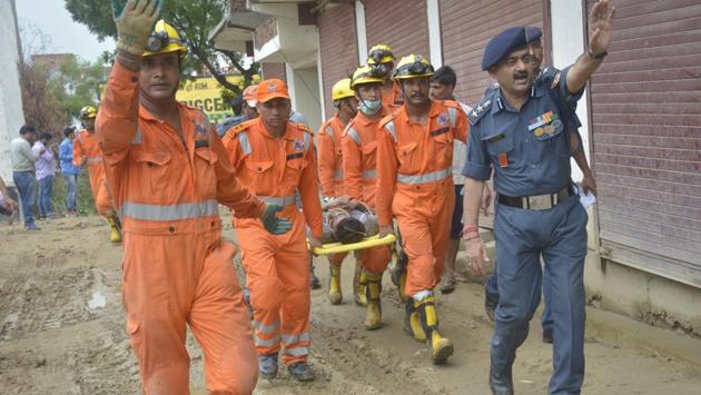 National Disaster Response Force carry out rescue operation after an under-construction building collapsed in Ghaziabad. (Sakib Ali /HT) National Disaster Response Force carry out rescue operation after an under-construction building collapsed in Ghaziabad. (Sakib Ali /HT)