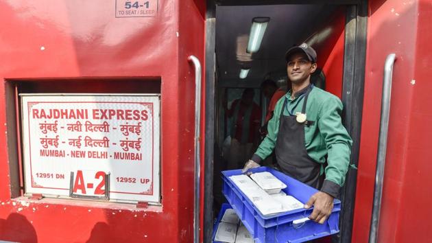 An Indian Railway Catering and Tourism Corporation (IRCTC ) worker carries foods in the newly launched eco-friendly disposable plates serving of meals to the passengers on Rajdhani Express train, at New Delhi Railway Station in New Delhi. (PTI Photo) An Indian Railway Catering and Tourism Corporation (IRCTC ) worker carries foods in the newly launched eco-friendly disposable plates serving of meals to the passengers on Rajdhani Express train, at New Delhi Railway Station in New Delhi. (PTI Photo)