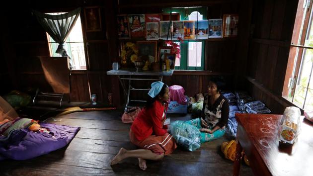 Touch visits a traditional Cambodian medicine shop during her one-hour lunch break. Already the mother of a four-year-old boy, she is due to give birth to a girl within two weeks, but maintains a punishing schedule in a shoe factory, working about 10 hours a day, six days a week. “I am the main breadwinner of the house,” she said. (Ann Wang / REUTERS) Touch visits a traditional Cambodian medicine shop during her one-hour lunch break. Already the mother of a four-year-old boy, she is due to give birth to a girl within two weeks, but maintains a punishing schedule in a shoe factory, working about 10 hours a day, six days a week. “I am the main breadwinner of the house,” she said. (Ann Wang / REUTERS)