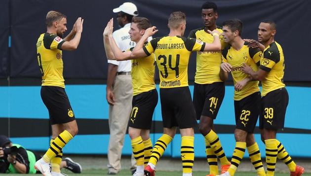 Members of the Borussia Dortmund team celebrate with Christian Pulisic #22 in a 3-1 win over Liverpool during an International Champions Cup match at Bank of America Stadium on July 22, 2018 in Charlotte, North Carolina.(AFP)