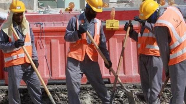 A file photo taken n November 16, 2014 shows workers at a construction site in Doha.(AFP File)