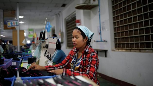 Khen Srey Touch, 27, sews shoes at Complete Honour Footwear Industrial, a footwear factory owned by a Taiwan company, in Kampong Speu, Cambodia. Whoever wins Cambodia’s general election next week, 27-year-old knows only that she will have to keep working hard for years to come. (Ann Wang / REUTERS) Khen Srey Touch, 27, sews shoes at Complete Honour Footwear Industrial, a footwear factory owned by a Taiwan company, in Kampong Speu, Cambodia. Whoever wins Cambodia’s general election next week, 27-year-old knows only that she will have to keep working hard for years to come. (Ann Wang / REUTERS)
