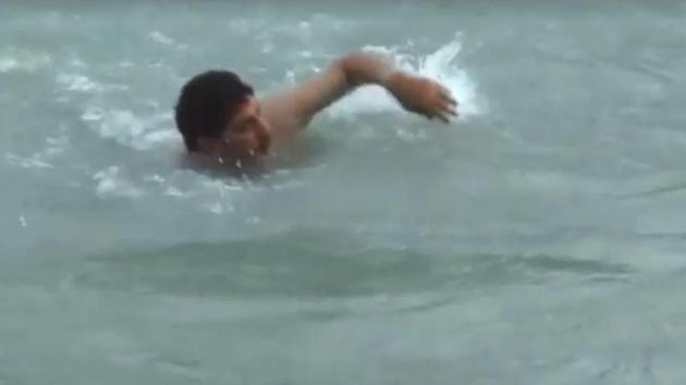 A video grab posted by Haryana BJP president Subhash Barala showing him swimming in a canal in his constituency Tohana in Fatehabad district. A video grab posted by Haryana BJP president Subhash Barala showing him swimming in a canal in his constituency Tohana in Fatehabad district.