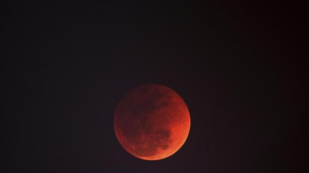The moon turns red during a lunar eclipse as seen in New Delhi on January 31, 2018.(AP file photo)