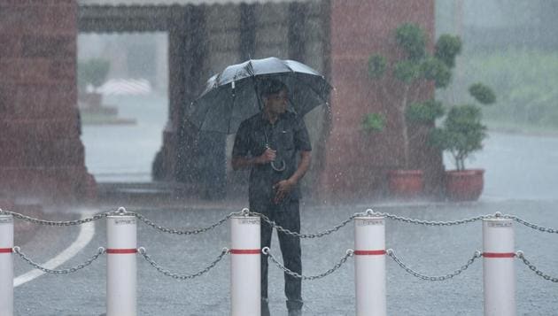 A man standing outside Parliament House in New Delhi on July 20, 2018. The weather bureau has warned of heavy rain in parts of the national capital and NCR on July 24 and July 25. (Vipin Kumar/HT PHOTO) A man standing outside Parliament House in New Delhi on July 20, 2018. The weather bureau has warned of heavy rain in parts of the national capital and NCR on July 24 and July 25. (Vipin Kumar/HT PHOTO)