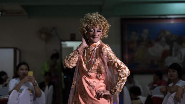 Enriquez walks the catwalk during the beauty pageant. Busa, the Golden Gays organiser, shrugs at the challenges of life and said what the group really needs is a permanent new home -- preferably paid for by a generous benefactor. “With or without permanent house the Golden Gays will survive,” he said. “That’s how we live -- hand to mouth. But we have to maintain our poise, our will to live,” added Busa. (Noel Celis / AFP) Enriquez walks the catwalk during the beauty pageant. Busa, the Golden Gays organiser, shrugs at the challenges of life and said what the group really needs is a permanent new home -- preferably paid for by a generous benefactor. “With or without permanent house the Golden Gays will survive,” he said. “That’s how we live -- hand to mouth. But we have to maintain our poise, our will to live,” added Busa. (Noel Celis / AFP)