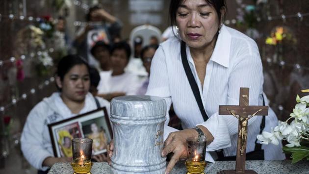 Relatives of late Golden Gays member George Fernandez, 71, also known as ‘Gloria Manila’, attend a mass before his ashes in the urn were laid to rest at a columbarium. Due to the age and precarious lives of the Golden Gays, the group has lost more than a few members to death. The most recent loss was Fernandez, who died in June of a blood infection. (Noel Celis / AFP) Relatives of late Golden Gays member George Fernandez, 71, also known as ‘Gloria Manila’, attend a mass before his ashes in the urn were laid to rest at a columbarium. Due to the age and precarious lives of the Golden Gays, the group has lost more than a few members to death. The most recent loss was Fernandez, who died in June of a blood infection. (Noel Celis / AFP)