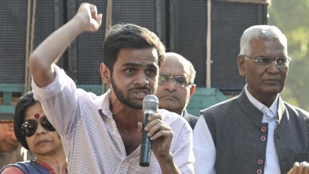 File photo of JNU student Umar Khalid (holding the mike) at a protest march in New Delhi on March 4, 2017. Khalid claims the university didn’t allow him to submit his PhD thesis despite instructions from Delhi HC. (Raj K Raj/HT File Photo) File photo of JNU student Umar Khalid (holding the mike) at a protest march in New Delhi on March 4, 2017. Khalid claims the university didn’t allow him to submit his PhD thesis despite instructions from Delhi HC. (Raj K Raj/HT File Photo)