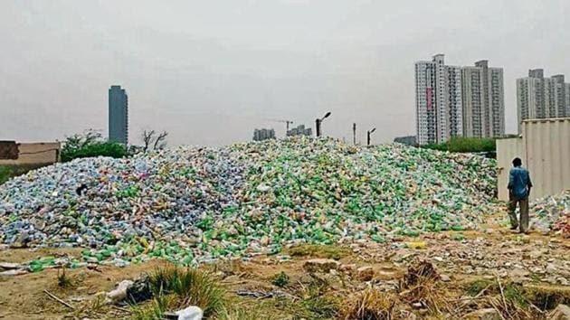 Plastic dumped by a warehouse in Basai village in Gurugram, June 2018.(Pankaj Gupta / HT File Photo)