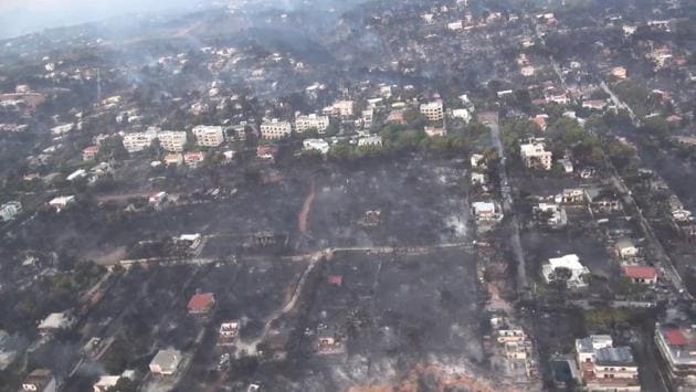 An aerial view of a burnt urban area following fire in Mati. Winds of above 100 kilometres per hour in Mati caused a “sudden progression of fire” through the village, said fire service spokeswoman Stavroula Maliri. The mayor of nearby Rafina, Evangelos Bournous even said that Mati no longer exists as more than a thousand buildings and 300 cars had been damaged. (Hellenic Ministry of Defence / AFP) An aerial view of a burnt urban area following fire in Mati. Winds of above 100 kilometres per hour in Mati caused a “sudden progression of fire” through the village, said fire service spokeswoman Stavroula Maliri. The mayor of nearby Rafina, Evangelos Bournous even said that Mati no longer exists as more than a thousand buildings and 300 cars had been damaged. (Hellenic Ministry of Defence / AFP)