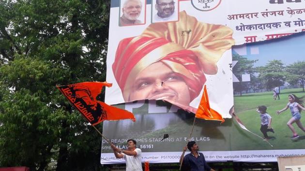 A hoarding with chief minister Devendra Fadnavis poster was vandalised by the protestors in Rango Bapuji Gupte Chowk near Talaopali in Thane. (Praful Gangurde / HT Photo) A hoarding with chief minister Devendra Fadnavis poster was vandalised by the protestors in Rango Bapuji Gupte Chowk near Talaopali in Thane. (Praful Gangurde / HT Photo)