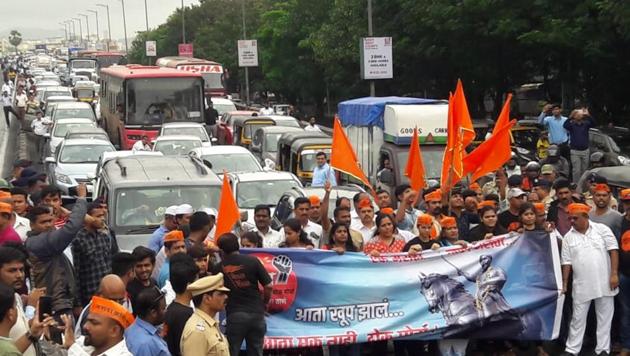 People shout slogans’ blocking the Eastern Express Highway at Teen Haat Naka in Mumbai during a shutdown called by Maratha outfits demanding reservation. After reports of several incidents of violence, Maratha leaders have called off the ongoing Mumbai shutdown and asked agitators in other parts of the state to follow suit. The agitation was later called off in Thane too. (Praful Gangurde / HT Photo) People shout slogans’ blocking the Eastern Express Highway at Teen Haat Naka in Mumbai during a shutdown called by Maratha outfits demanding reservation. After reports of several incidents of violence, Maratha leaders have called off the ongoing Mumbai shutdown and asked agitators in other parts of the state to follow suit. The agitation was later called off in Thane too. (Praful Gangurde / HT Photo)