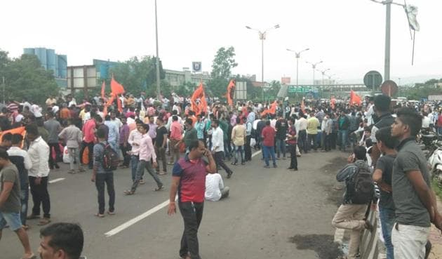 Agitators blocked Mumbai-Pune Expressway at its entry-exit point in Kalamboli on Wednesday afternoon.(HT Photo)