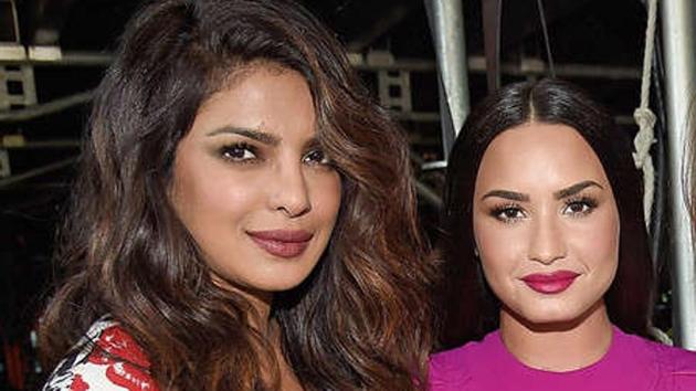 Priyanka Chopra and Demi Lovato at the Global Citizen Concert. Priyanka Chopra and Demi Lovato at the Global Citizen Concert.